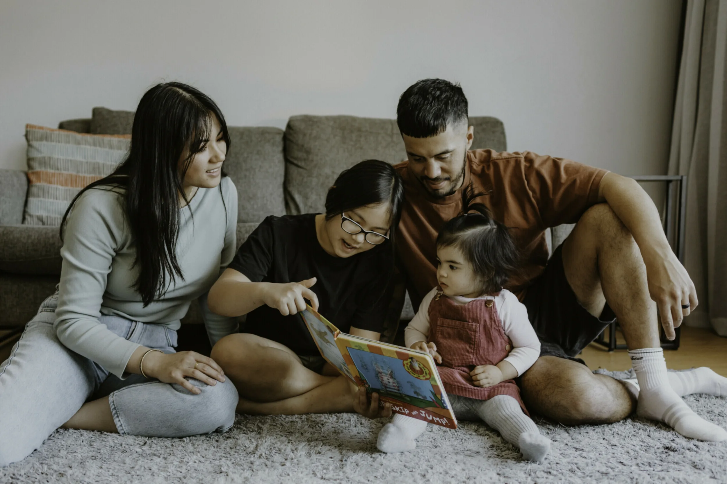 Family reading to young child